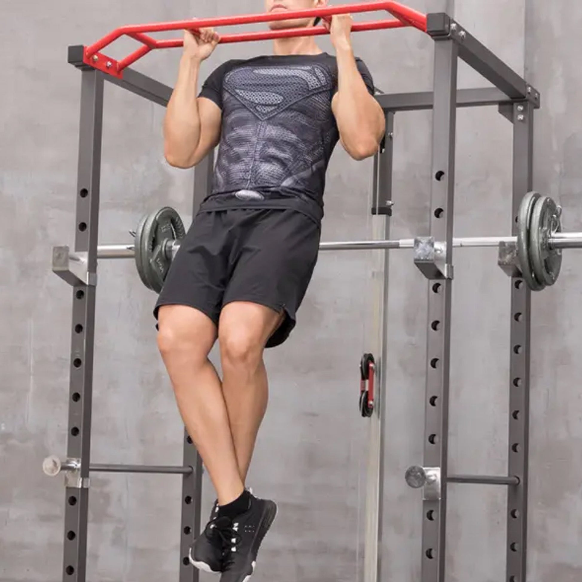 Heavy‑duty steel power rack with multi‑grip pull‑up bar and high/low cable pulley system. Adjustable safety, dip handles, and Olympic bar compatibility – all‑in‑one home gym powerhouse.